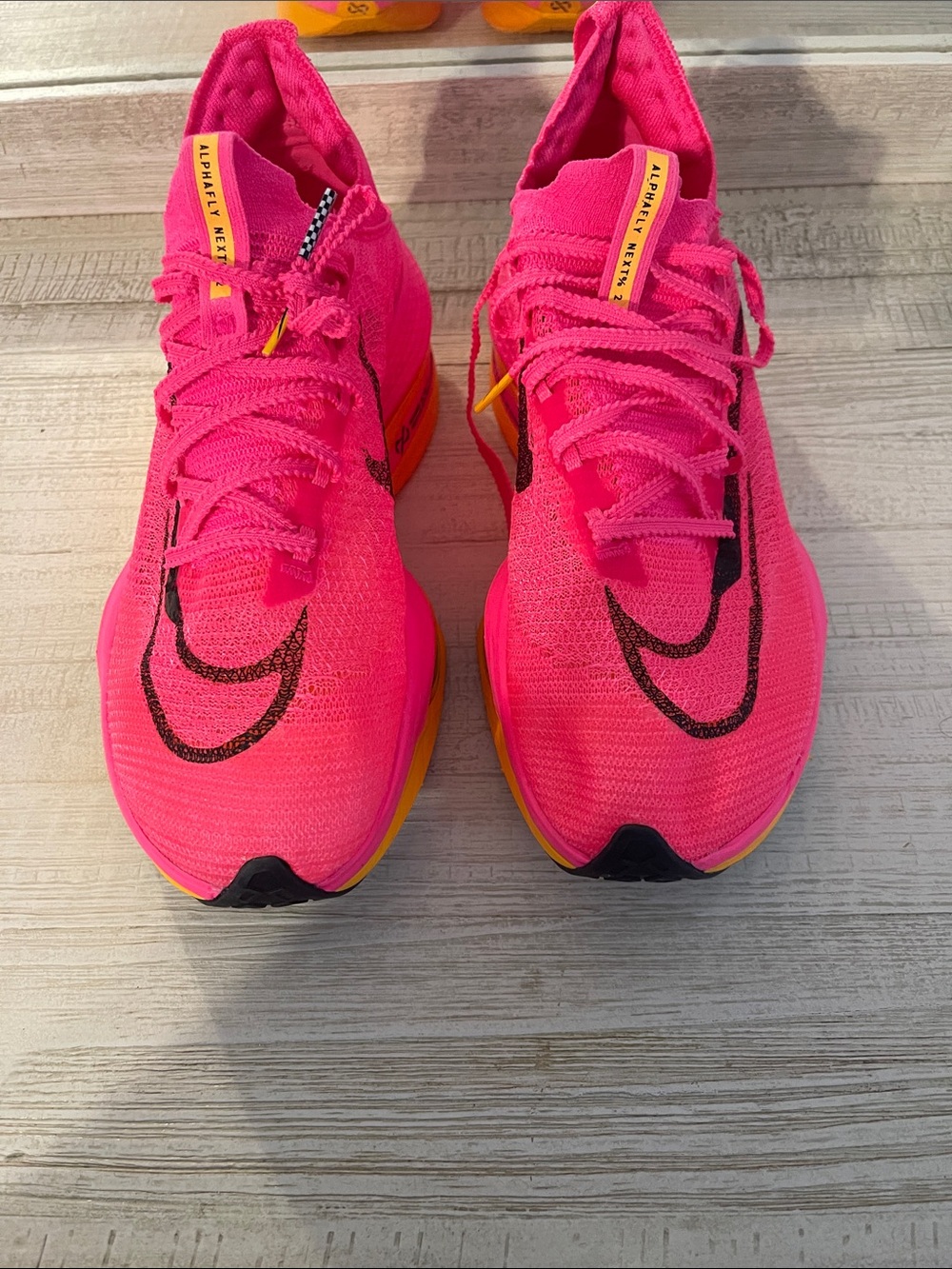 Nike Hot Pink Running Sneakers with Black Swoosh and Yellow Accents